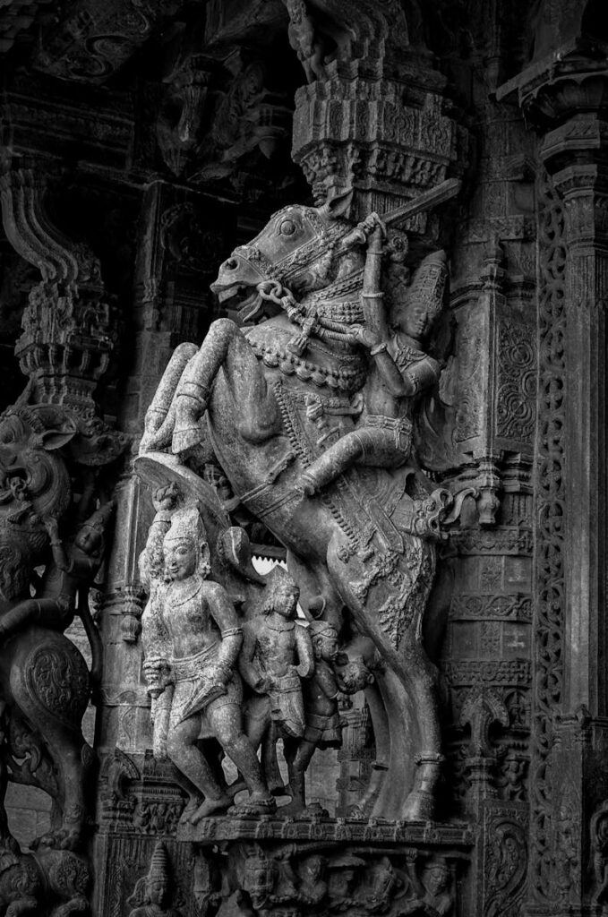 A detailed black and white view of a traditional stone sculpture at a Vellore temple, Tamil Nadu, India.