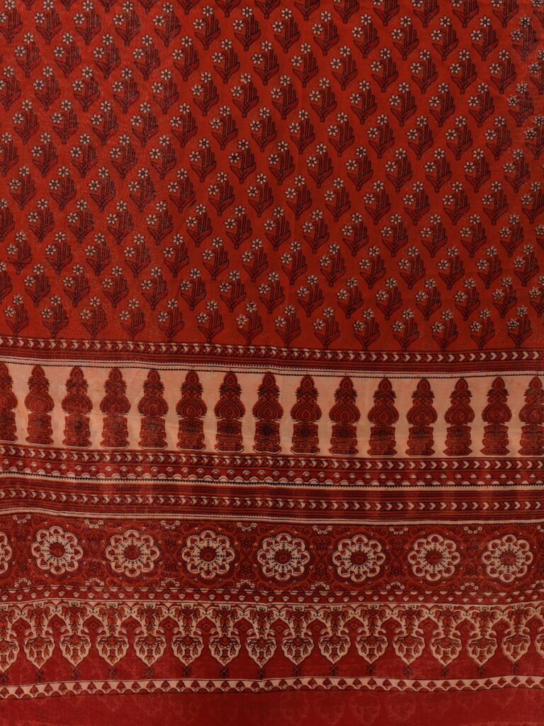 a close up of a red and white cloth